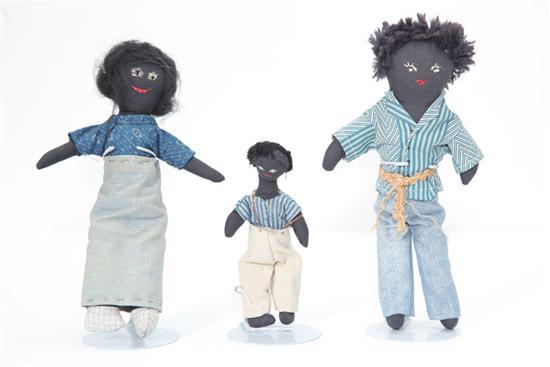 Appraisal: THREE CLOTH DOLLS A family of black dolls with sewn