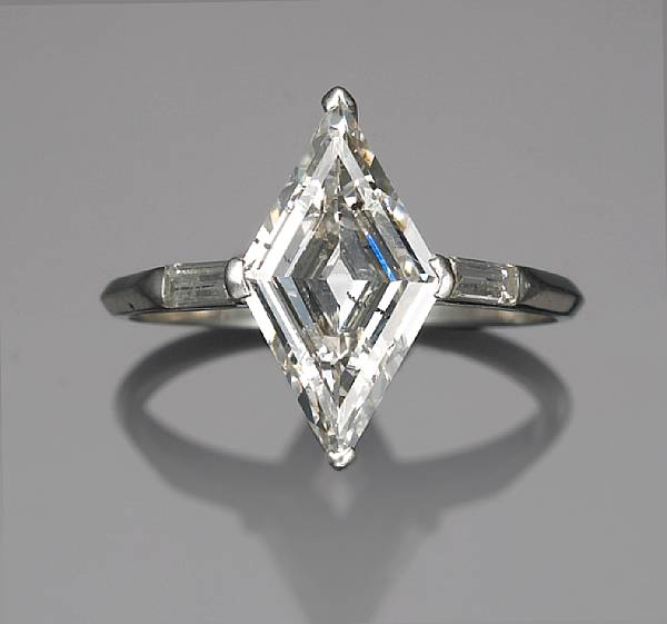 Appraisal: A diamond ring centering a lozenge-shaped diamond weighing approximately carat