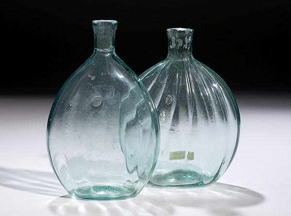 Appraisal: TWO PATTERN-MOLDED MIDWESTERN CHESTNUT BOTTLES attributed to the Mantua Glass