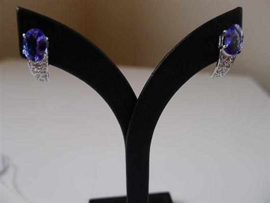 Appraisal: A PAIR OF TANZANITE AND DIAMOND EARRINGS IN CT WHITE