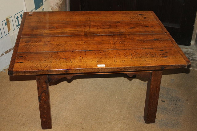 Appraisal: A FRENCH STYLE OAK COFFEE TABLE on square cut legs