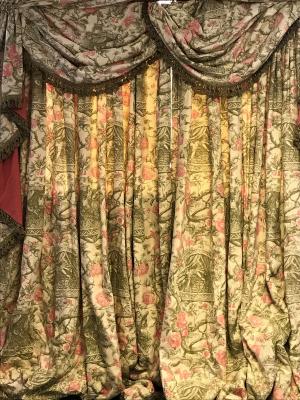 Appraisal: A pair of curtains with drapes and cornice decorated trailing