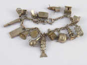 Appraisal: A silver charm bracelet with charms approx cm long