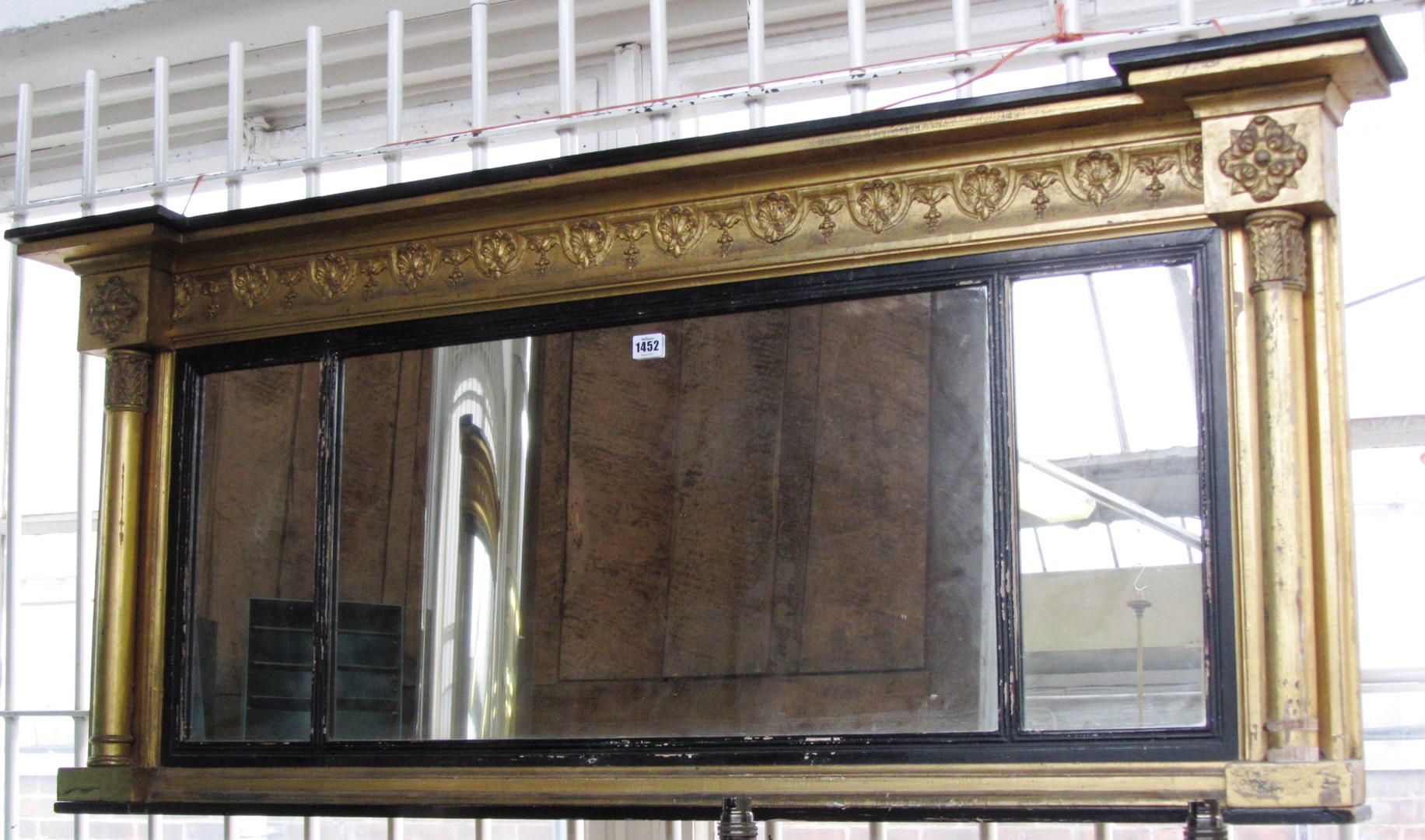 Appraisal: A Regency gilt framed triple plate overmantel mirror with turned