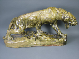 Appraisal: A large stoneware model of a panther after a model