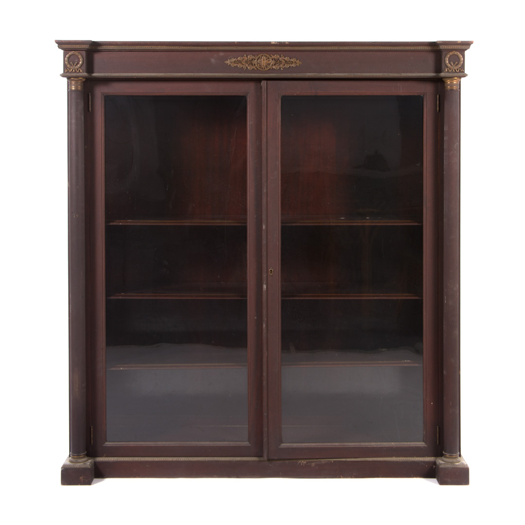 Appraisal: Empire style mahogany brass mounted bookcase early th century flat