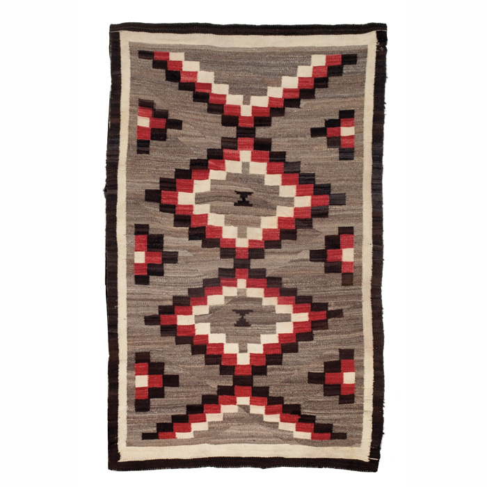 Appraisal: Navajo rug c stylized diamond design in red brown and