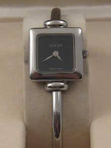 Appraisal: A lady's stainless steel bangle watch quartz by Gucci in