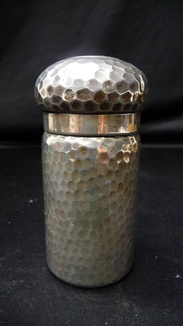 Appraisal: A sterling silver dressing table canister the hammered cylindrical body