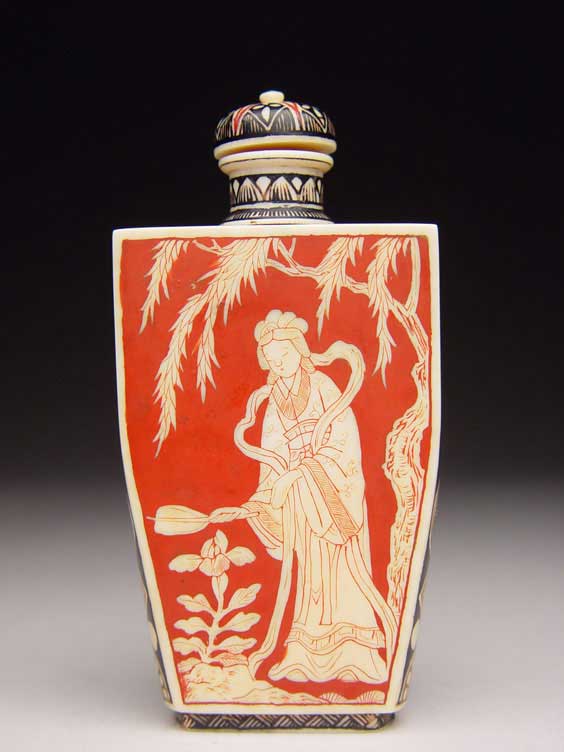 Appraisal: ANTIQUE IVORY SNUFF BOTTLE Antique carved and lacquered ivory snuff