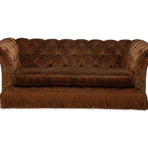 Appraisal: A Chesterfield Style Velvet-Upholstered Sofa with a Fringed Skirt th