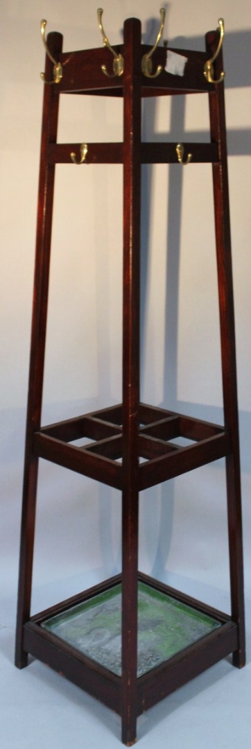 Appraisal: An early thC mahogany stained hall stand with metal pegs