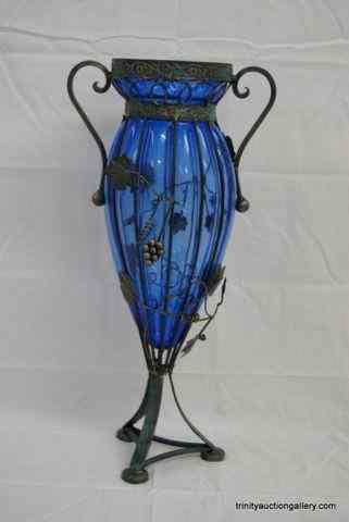 Appraisal: Hand Blown Blue Glass Vase on Metal StandIs a very