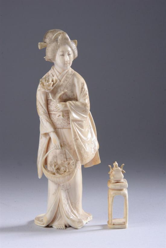 Appraisal: JAPANESE IVORY OKIMONO Meiji period Signed standing wearing a kimono