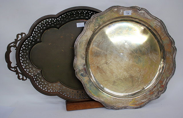 Appraisal: A LARGE CIRCULAR WHITE METAL SALVER cm diameter together with