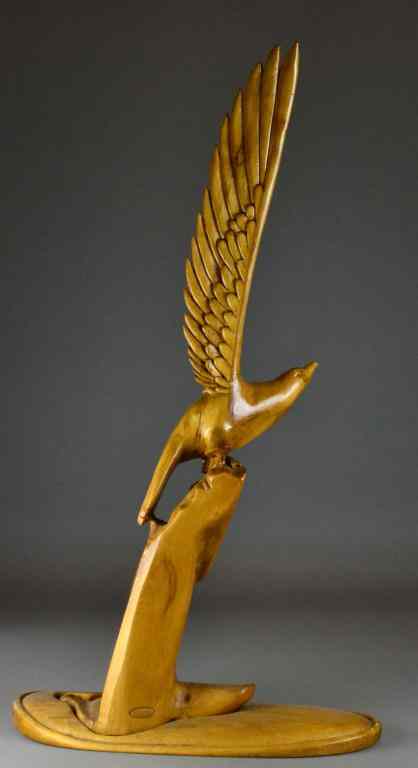 Appraisal: A Large Impressive American Carved Wood EagleStanding spread wing on