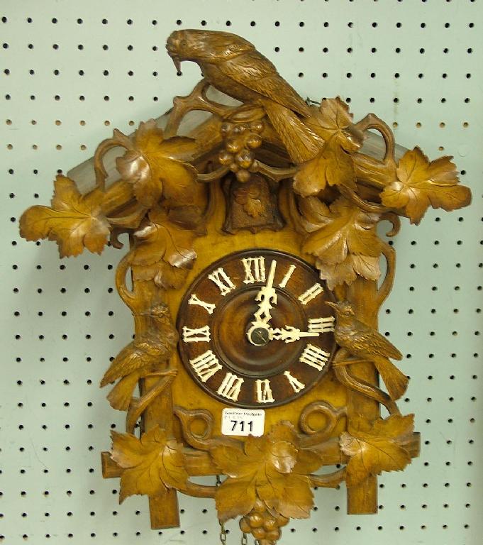 Appraisal: Black Forest two train cuckoo clock the dial within a