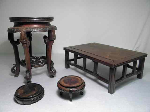 Appraisal: Late th early th century Chinese carved wood stands Includes