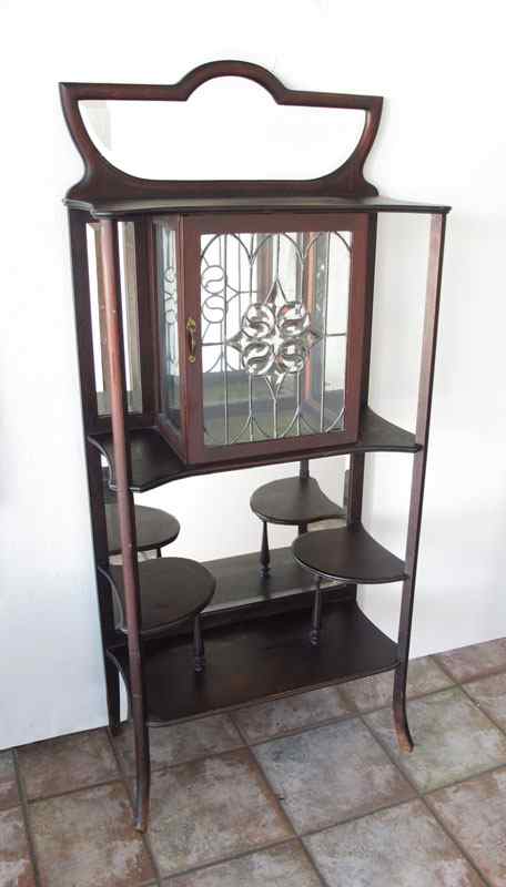 Appraisal: A PETITE MAHOGANY EDWARDIAN ETAGERE Mirror back upper and lower