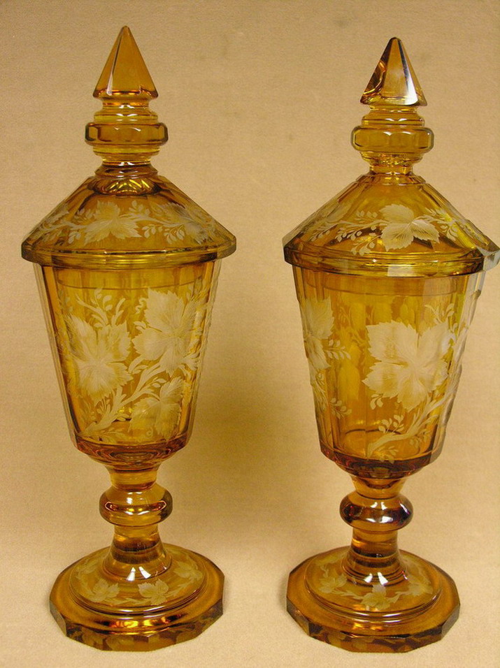 Appraisal: PAIR INTAGLIO CUT LIDDED URNS very heavy glass ground and