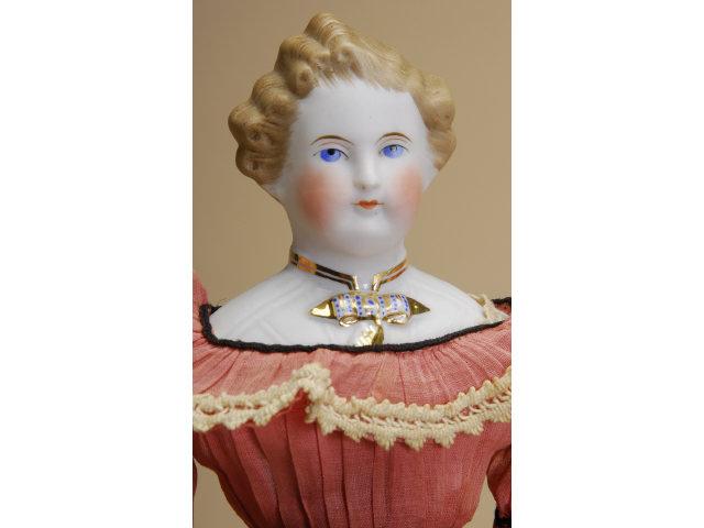 Appraisal: Parian Doll with Molded Bodice Germany ca untinted bisque shoulder