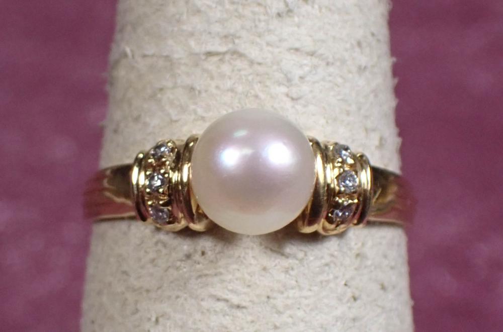 Appraisal: PEARL DIAMOND AND FOURTEEN KARAT GOLD RING The yellow gold