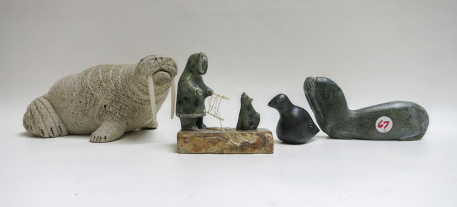 Appraisal: FOUR ESKIMO CARVINGS OF SOAPSTONE AND PUMICE the walrus by