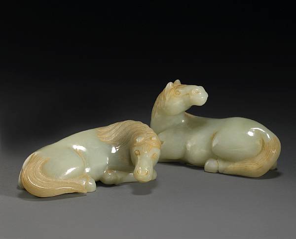 Appraisal: A pair of nephrite recumbent horses th Century One horse