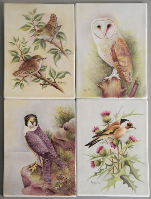 Appraisal: Set of four painted porcelain bird plaques signed Bryan Cox