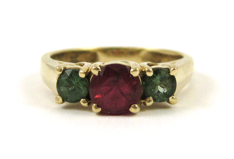 Appraisal: TOURMALINE AND FOURTEEN KARAT GOLD RING with two round-cut green