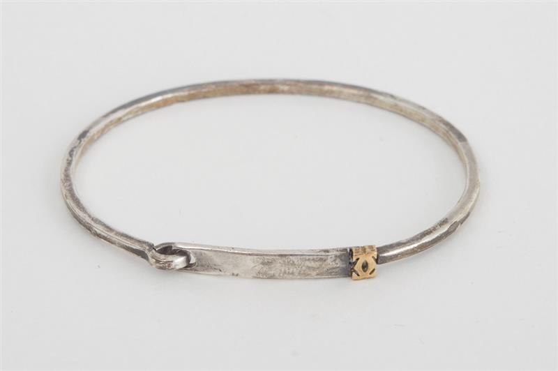 Appraisal: CARTIER STERLING SILVER AND K YELLOW GOLD BRACELET Signed and