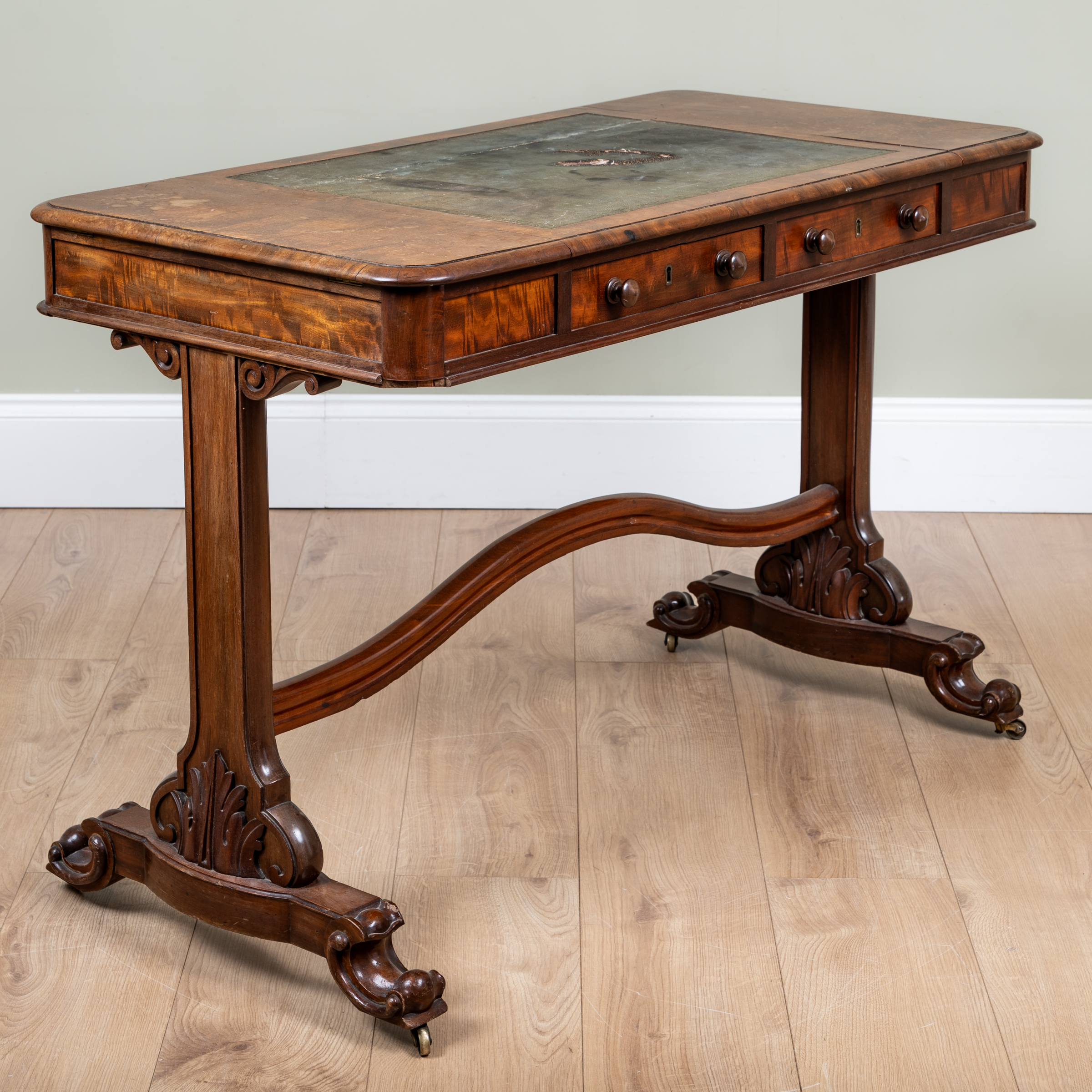 Appraisal: A th century mahogany writing table with central leather inset