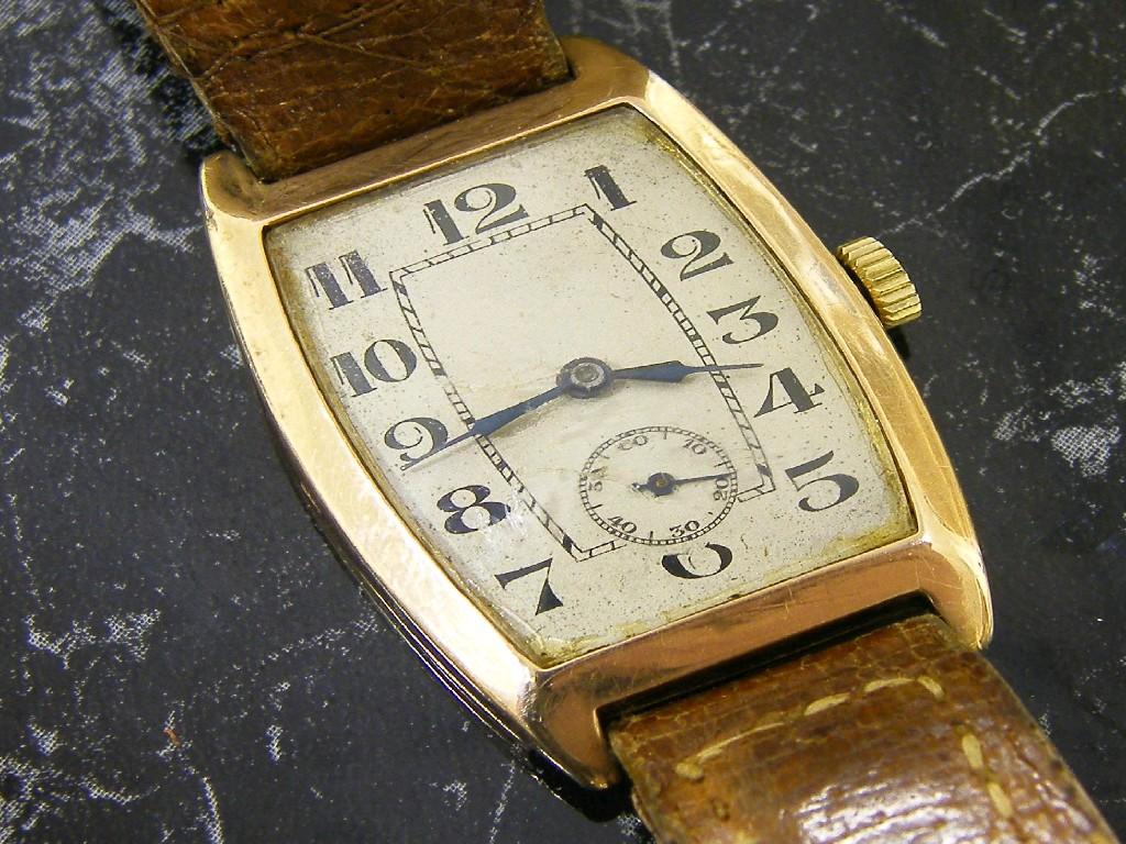 Appraisal: ct s tonneau shaped gentleman's wristwatch the silvered dial with