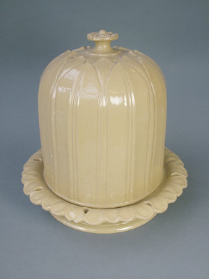 Appraisal: Large pottery cheese dome in a mocha glaze with moulded