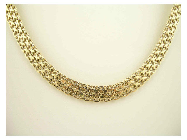 Appraisal: K two-tone gold fashion necklace in belt motif necklace is