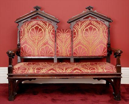 Appraisal: AMERICAN GOTHIC REVIVAL CARVED ROSEWOOD DOUBLE CHAIR-BACK SETTEE Each arched