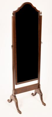 Appraisal: A walnut framed cheval mirror the shaped glass on square