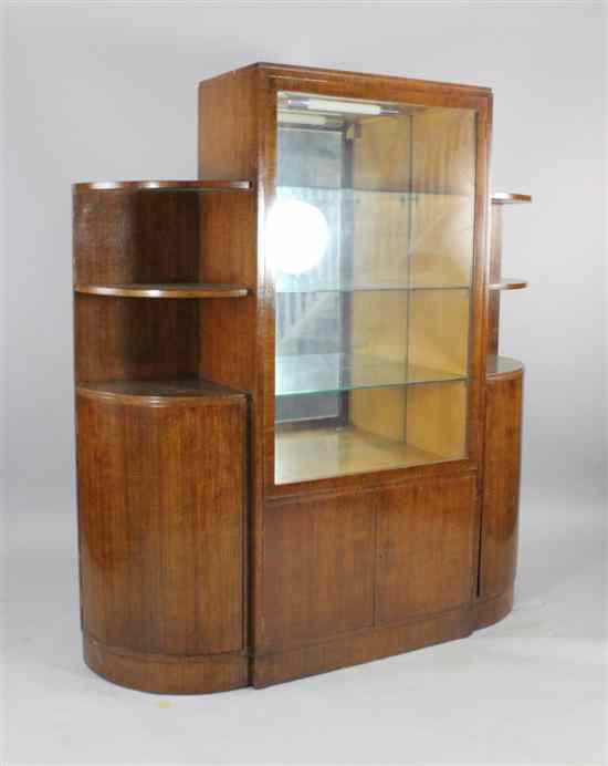 Appraisal: An Art Deco mahogany display cabinet with single glazed door