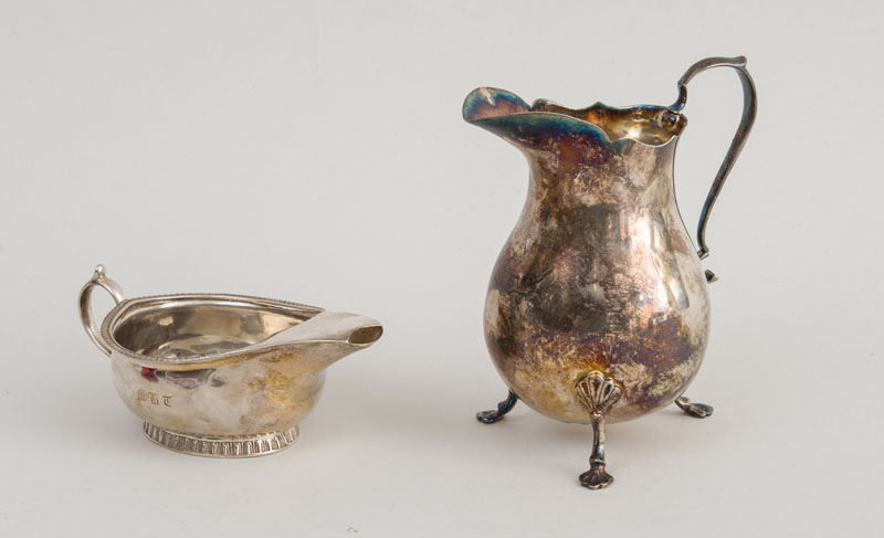 Appraisal: AMERICAN SILVER TRIPOD CREAMER AND A SILVER PAP BOAT With