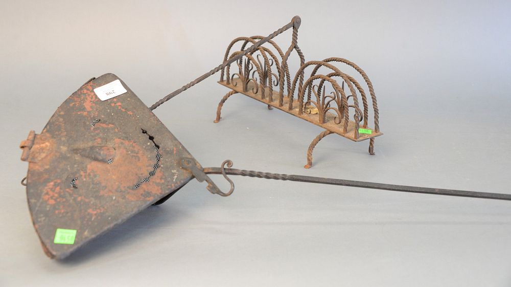 Appraisal: Two primitive iron pieces toaster along with an apparatus having