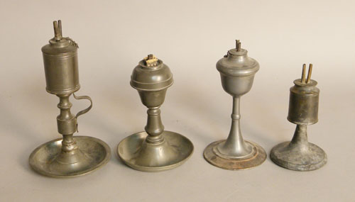 Appraisal: Four pewter fluid lamps early to mid th c to