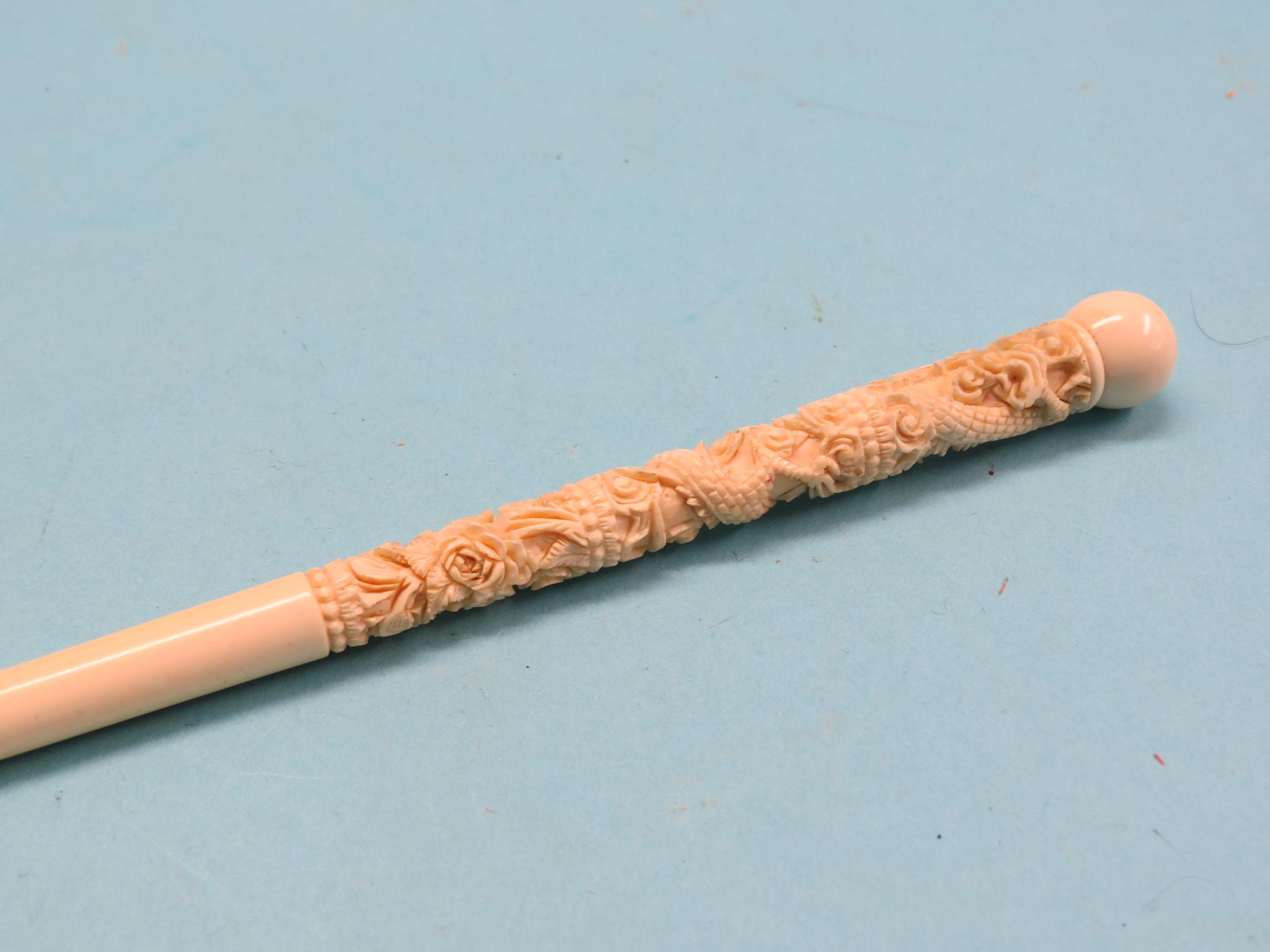 Appraisal: A Chinese carved ivory parasol handle in