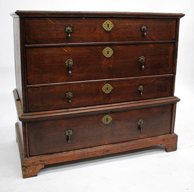 Appraisal: AN ANTIQUE POSSIBLY EARLY TH CENTURY OAK CHEST OF FOUR