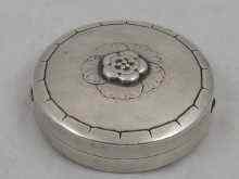 Appraisal: A Georg Jensen silver compact with raised floral motif approx