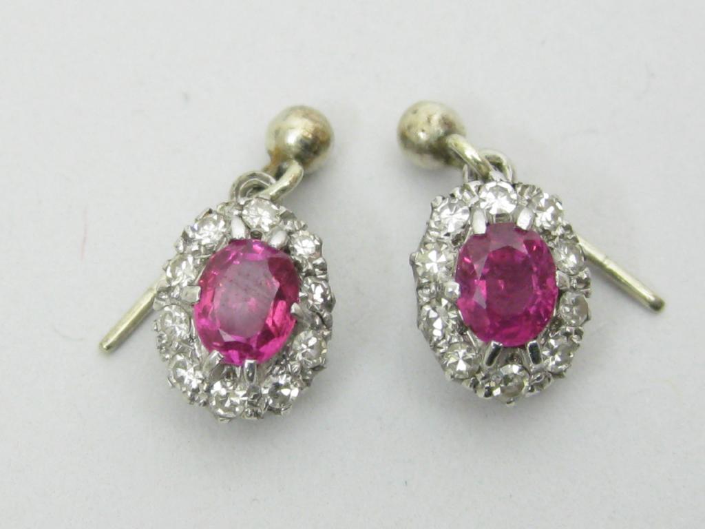 Appraisal: A pair of Ruby and Diamond Earrings each with central