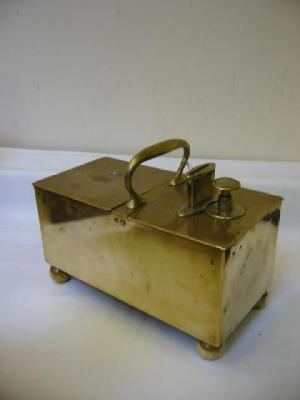 Appraisal: A PATENT BRASS TOBACCO DISPENSER of oblong form with loop