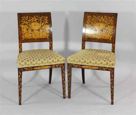 Appraisal: A pair of th century Dutch marquetry inlaid walnut chairs