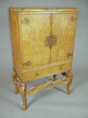 Appraisal: A William and Mary style burr walnut cocktail cabinet 's