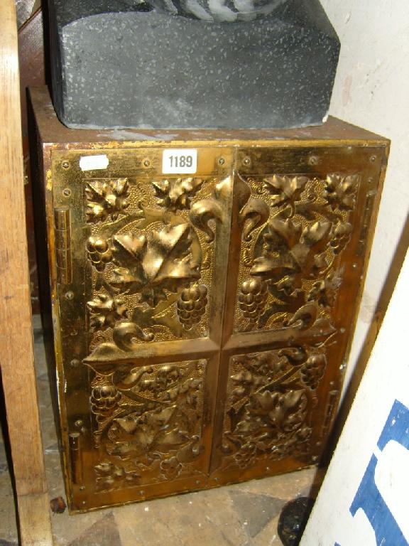 Appraisal: A small Victorian cast iron framed wall safe enclosed by