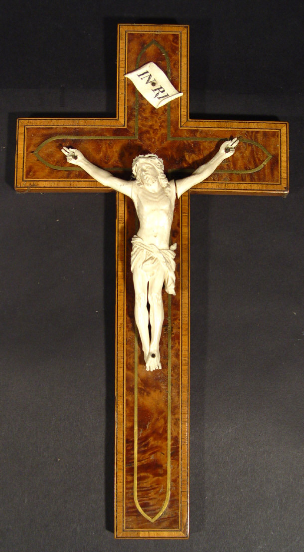 Appraisal: Carved ivory figure of Christ on a burr walnut crucifix